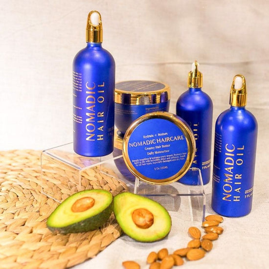 Product image with hair oil and hair butter and avocados in the foreground
